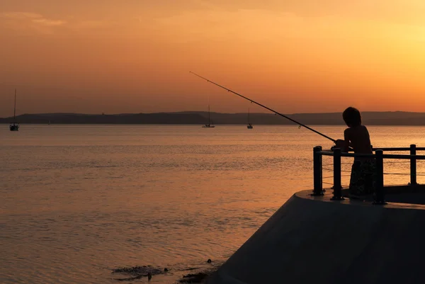 Rybář západ slunce — Stock fotografie
