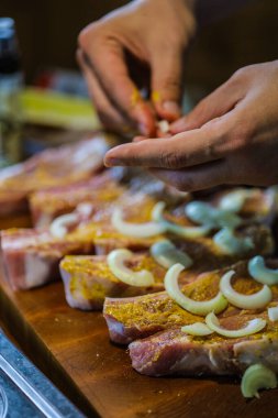 Pork with ribs. Tenderloin. entrecote Fresh and raw meat. Natural food products. Meat with spices: pepper salt lime mustard onion.