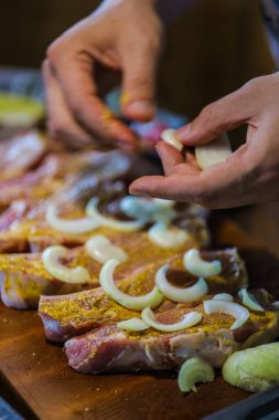 Pork with ribs. Tenderloin. entrecote Fresh and raw meat. Natural food products. Meat with spices: pepper salt lime mustard onion.