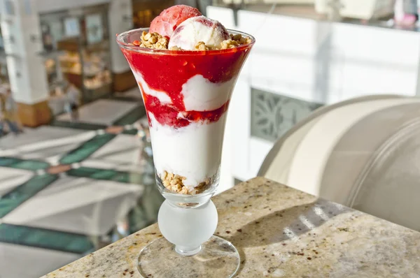 Tasty dessert - vanilla and strawberry ice cream sundae