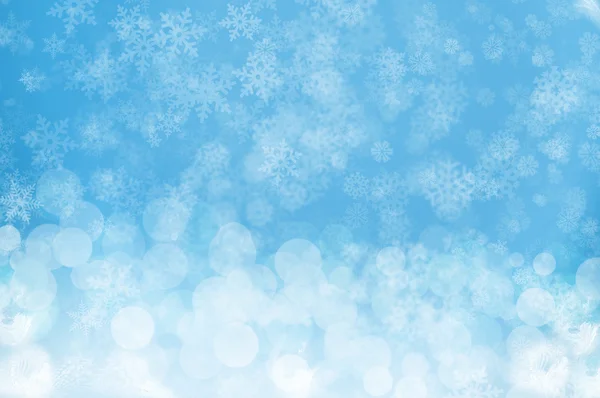 Niebieskim tle śnieg — Zdjęcie stockowe