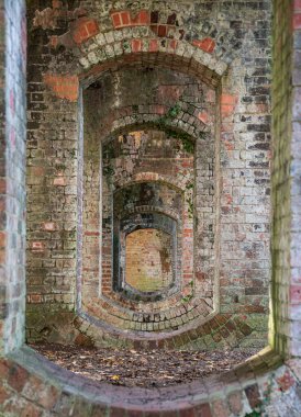 A bridge over the old dismantled railway line, a striking example of the Railway Age with ten arches A good example of Victorian railway engineering. South Cerney, Gloucestershire, United Kingdom
