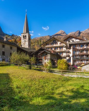 The beautiful village of Alagna Valsesia, during fall season, in Valsesia (Sesia Valley). Province of Vercelli, Piedmont, Italy. clipart