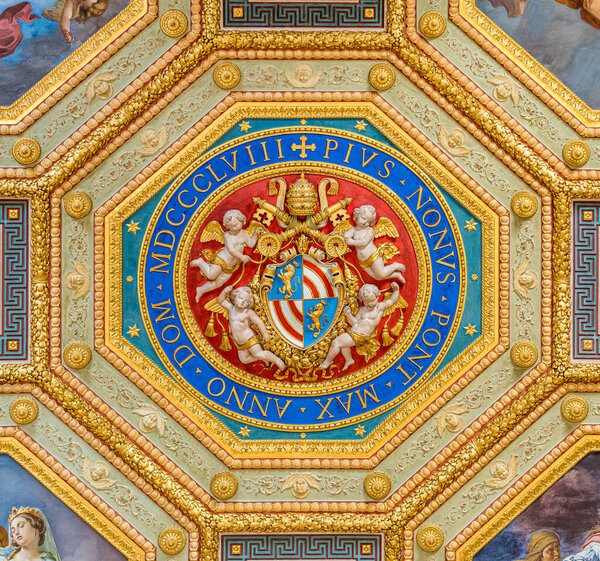 Pius IX coat of arms in ceiling of the Musei Vaticani of Rome, Italy.
