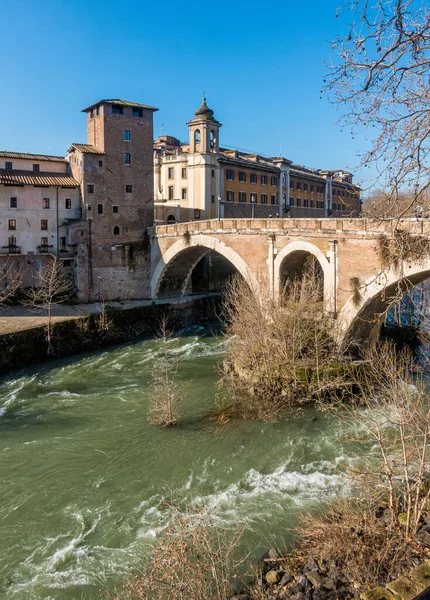Tiber Island and Fabricio\'s Bridge as seen from the riverside, Rome, Italy.