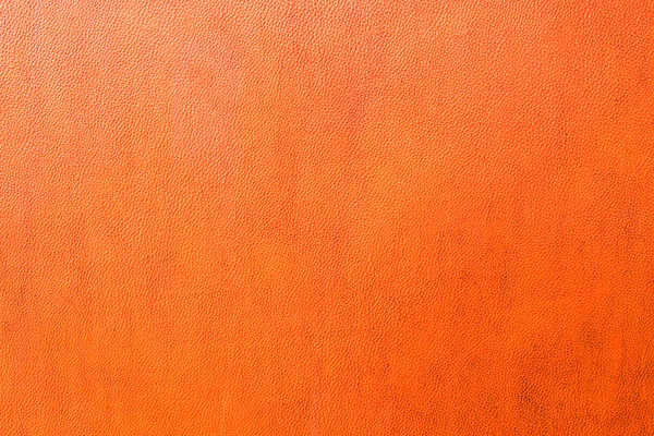 Hintergründe aus orangefarbenem Leder — Stockfoto