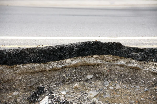 Collapsed asphalt road and dent — Stock Photo, Image