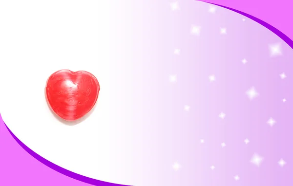 Doce de coração no cartão rosa — Fotografia de Stock