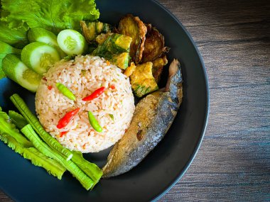 Fried rice with spicy shrimp paste dip on the table