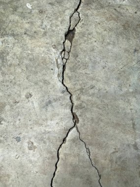 Cement floor with big crack and dirty