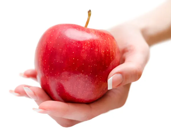 Female hand giving apple — Stock Photo, Image