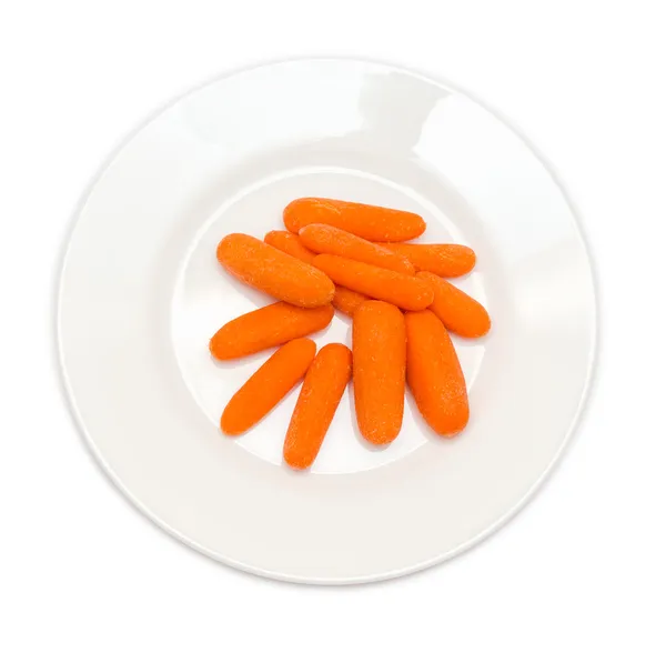 Skrællede gulerødder i tallerken - Stock-foto