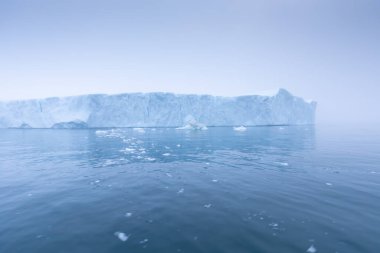 Climate change and global warming. Icebergs from a melting glacier in Ilulissat Glacier, Greenland. The icy landscape of the Arctic nature in the UNESCO world heritage site.