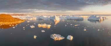 Climate change and global warming. Icebergs from a melting glacier in Ilulissat Glacier, Greenland. The icy landscape of the Arctic nature in the UNESCO world heritage site.