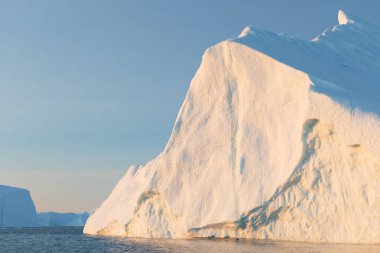 Climate change and global warming. Icebergs from a melting glacier in Ilulissat Glacier, Greenland. The icy landscape of the Arctic nature in the UNESCO world heritage site.
