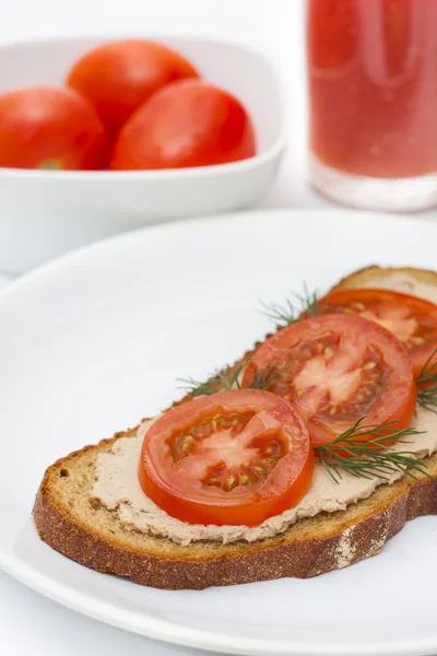 Fresh pate on bread with tomatoes — Stock Photo, Image