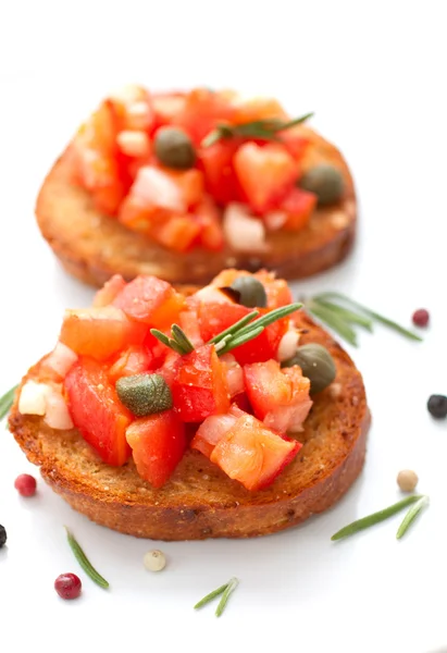 Bruscetta with tomatoes and rosemary — Stock Photo, Image