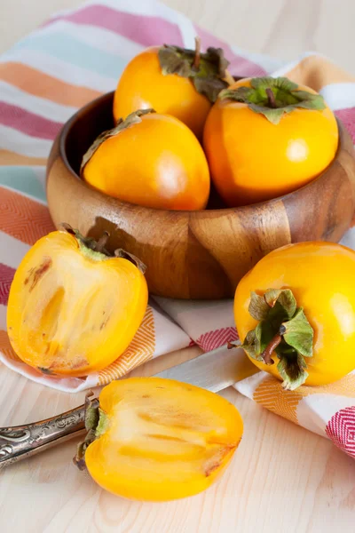 Persimmons in bowl — Stock Photo, Image