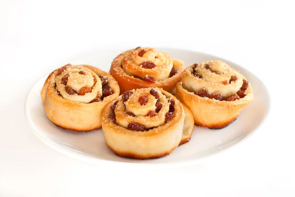 Group of delicious swirl buns with raisins and brown sugar — Stock Photo, Image