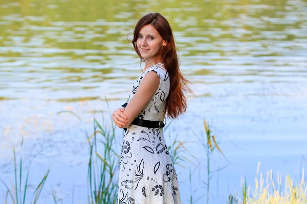 Portrait of a young pretty woman at the lake Royalty Free Stock Images