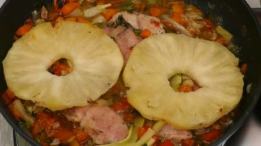 Cooking the lunch in the pan, bittersweet chicken. Delicious sweet and sour chicken in the pan