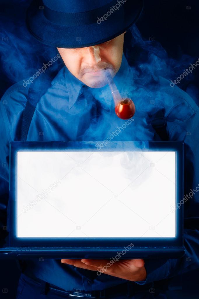 Man with Hat and Pipe Holding Laptop with White Screen