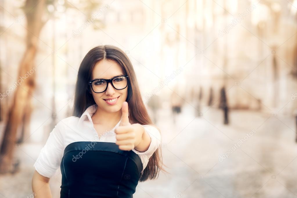 Young Woman with Glasses Thumb Up