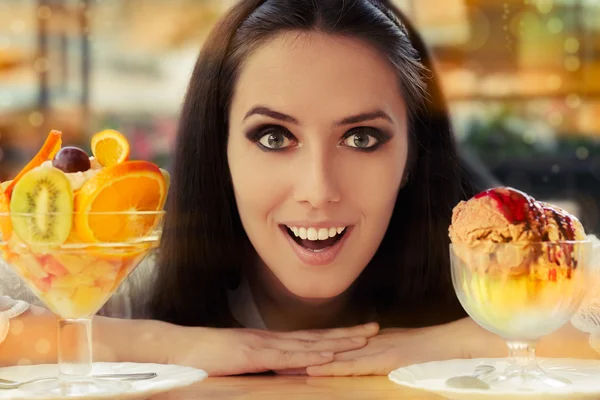 Young Woman Choosing Between Fruit Salad and Ice Cream Desserts — Stock Photo, Image