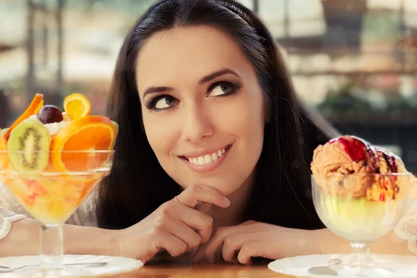 Young Woman Choosing Between Fruit Salad and Ice Cream Desserts — Stock Photo, Image