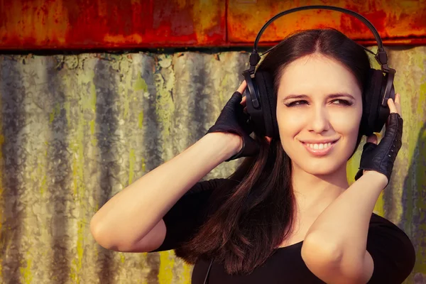 Girl with Big Headphones on Grunge Background — Stock Photo, Image