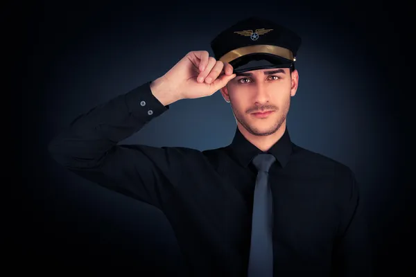 Pilot salutiert zurückhaltend — Stockfoto