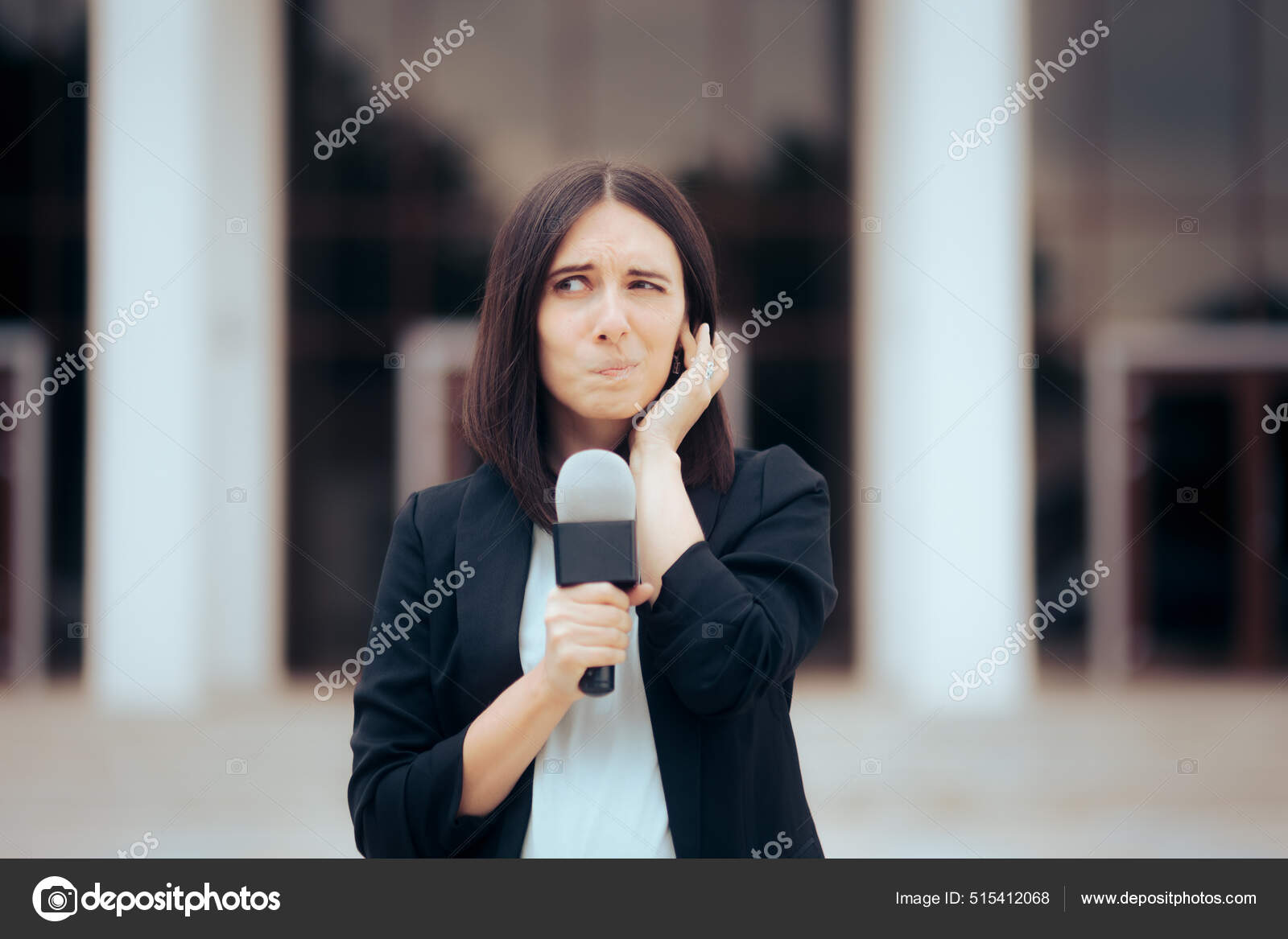 Female Reporter Fitting Earpiece Preparing Live Stock Photo by