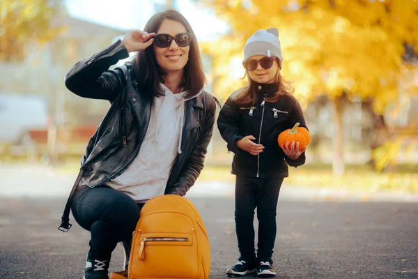Fashionable Mom and Daughter Wearing Leather Jacket and Sunglasses