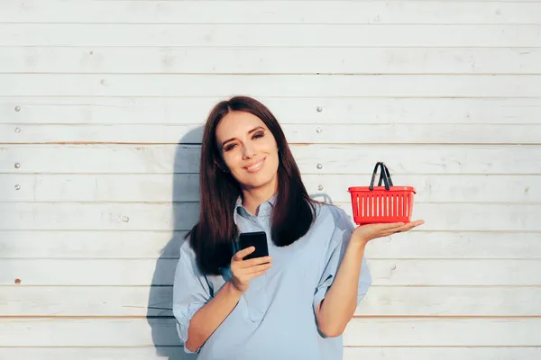 Happy Woman Holding Smartphone Shopping Basket — Stock Photo, Image