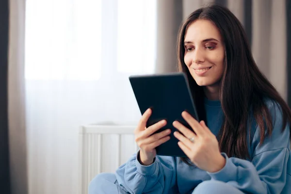 Happy Woman Checking Tablet Sitting Bed — Stock Photo, Image