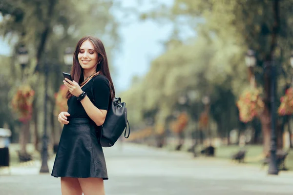 Beautiful Young Woman Holding Her Smartphone Backpack — Stock Photo, Image
