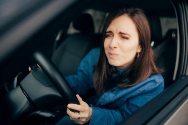 Woman Squinting and Driving Not Having Proper Visibility clipart
