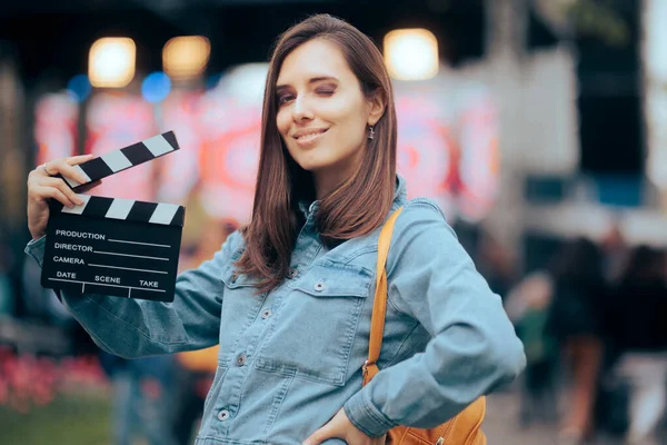 Happy Female Director Holding Film Slate Attending Festival — Zdjęcie stockowe