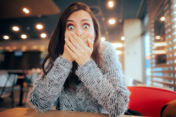 Shocked Woman Covering Her Mouth Sitting Restaurant — стоковое фото