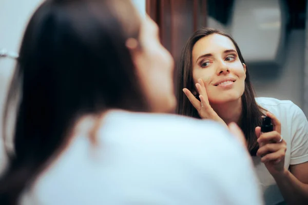 Woman Putting Foundation Front Mirror Using Her Fingers — Stockfoto