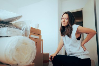 Woman Suffering from Back Aches During Relocation Moving Process