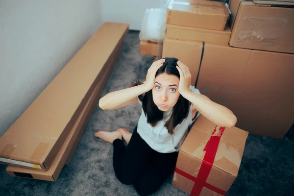 Stressed Homeowner Surrounded Cardboard Boxed Furniture — стокове фото
