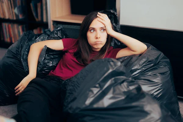 Woman Surrounded with Plastic Bags after Decluttering and Editing her Wardrobe