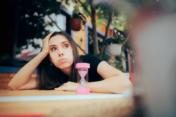 Bored Woman Waiting Next Hourglass — Stock Fotó