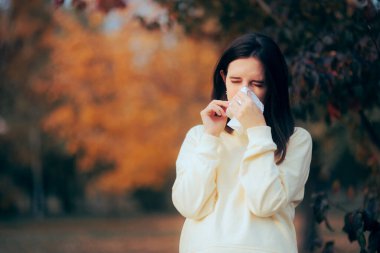 Woman Having Cold Symptoms and Running Nose from Autumn Allergies 