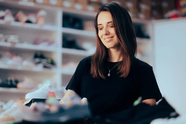 Beautiful Shop Assistant Working in a Shoes Store