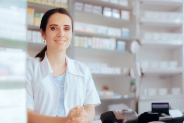 Pharmacist Smiling from Over the Counter in Drugstore 