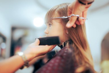 Toddler Girl Getting her Bangs Cute in a Professional Salon