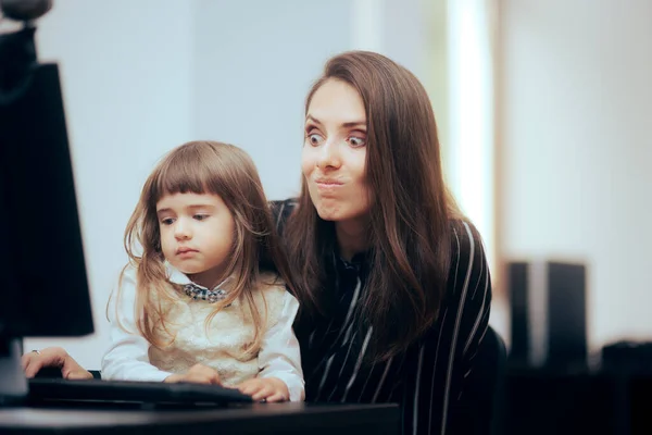 Stressed Mom Unable to Properly do Her Work Holding her Child