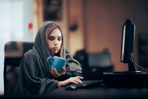 Unhappy Employee Working in Cold Freezing Office with No Heat